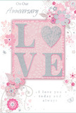 This anniversary card offers a gentle tribute to long-lasting romance, echoing the kind of thoughtful gestures couples in Basildon might exchange after years together. The colour palette blends soft pastel pinks, cool silvery greys, and touches of white, creating a mood of treasured intimacy as serene as a peaceful evening stroll through Gloucester Park. At the centre, the word LOVE is displayed in raised, softly glittering letters, each stroke edged with subtle sparkle that catches the light without overwhelming the design. The O is transformed into a shimmering silver heart, textured to stand out as the emotional core of the card. Around this heart-filled word, delicate blooms in blush, pale mauve, and ivory unfurl with a dreamy, watercolor softness, their petals feathered with careful shading to suggest the depth and curve of real flowers in an anniversary bouquet. Fine, flowing lines extend from each blossom, forming curling stems, loose swirls, and tiny flourishes that add a sense of movement, like vines gently swaying in a light breeze across Basildon gardens. Hidden among the petals are small decorative details-miniature butterflies, scattered petals, and graceful scrolls-that lend the composition a touch of whimsy and romance. The words On Our Anniversary and I love you today and always are set in elegant, understated script, giving voice to quiet yet enduring affection. The overall effect is that of a softly spoken promise: a card that feels as tender as a hand-held bouquet, perfect for marking an anniversary and affirming that love remains at the heart of everyday life.